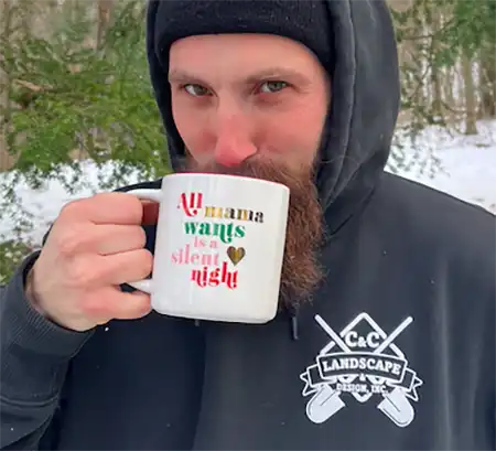 Man drinking hot tea outside