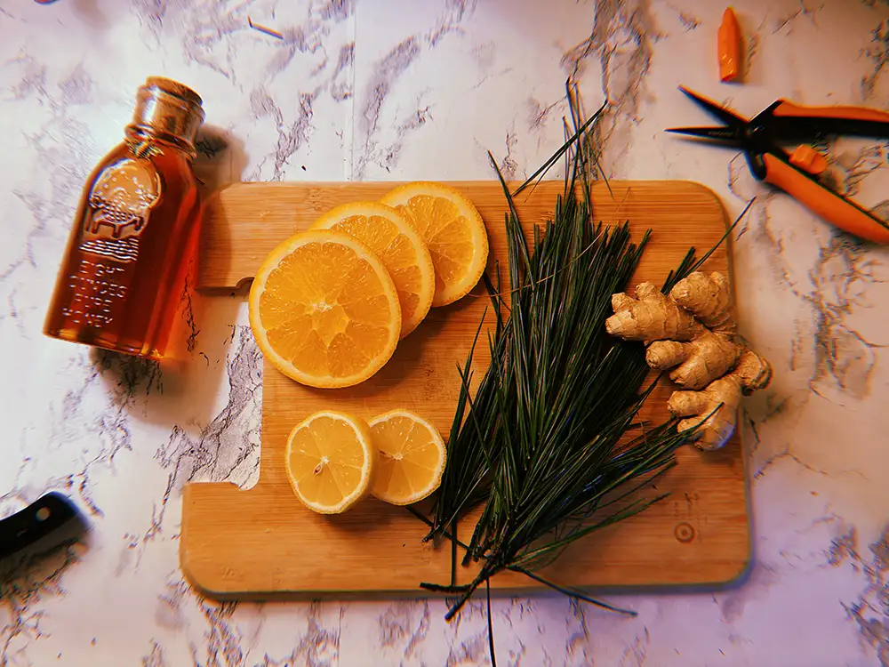 honey, orange and ginger on counter